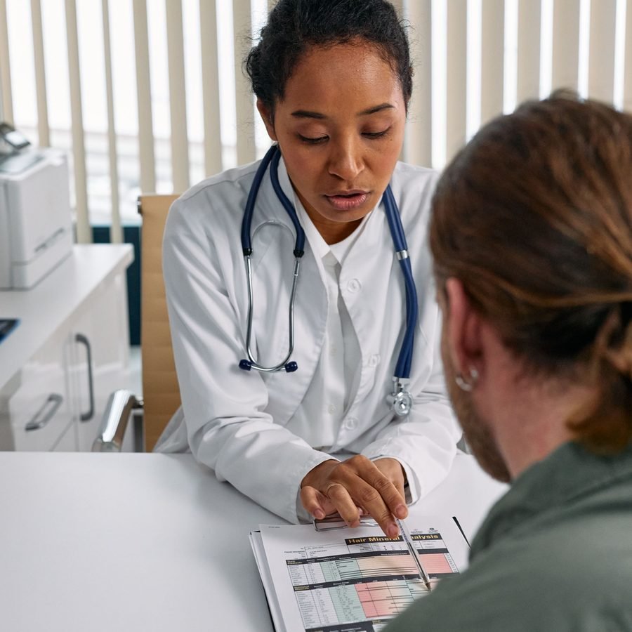 Doctor explaining a health chart to a patient